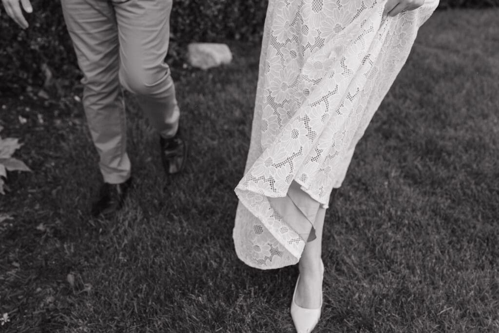 Couple walking together during an engagement session at Felt Estate in Saugatuck, Michigan