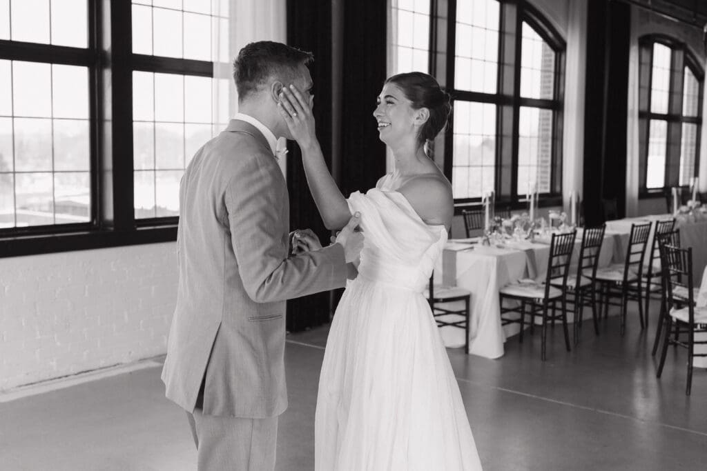 Bride and groom sharing their first look at The Collins Off Main Clocktower wedding venue