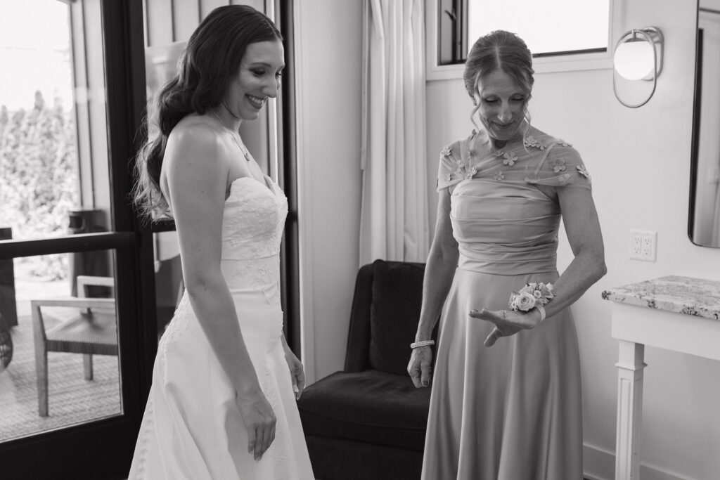 Bride and her mom share a quiet getting-ready moment before the wedding ceremony at Port 393 in Holland, Michigan.